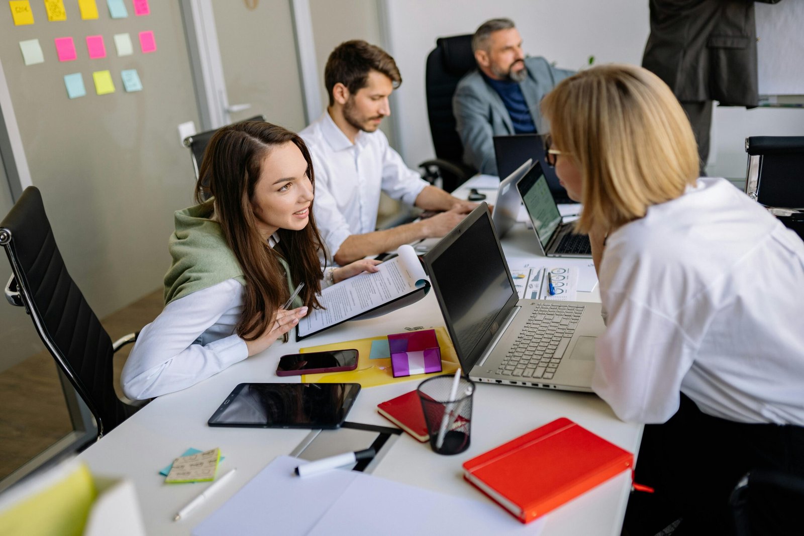 Team discussion in a modern office setting, focusing on cooperation and strategy development.
